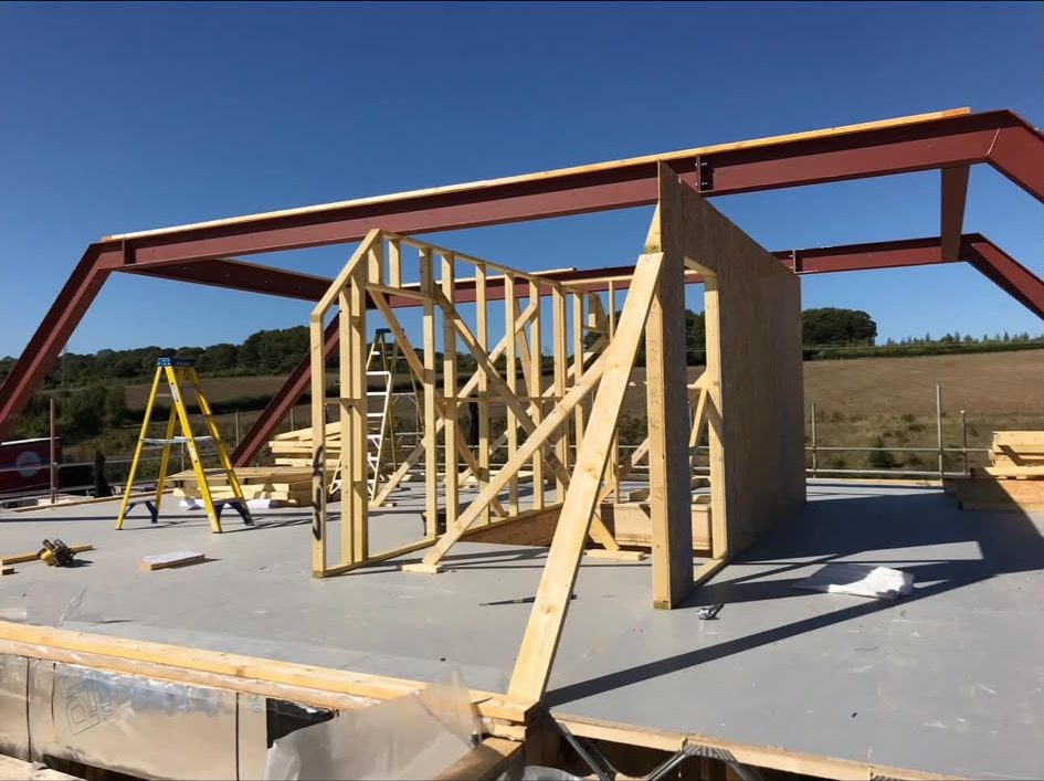 Panels stood off the steel beams